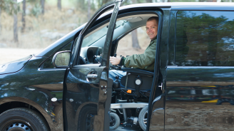 Disabled man in wheelchair drive a car