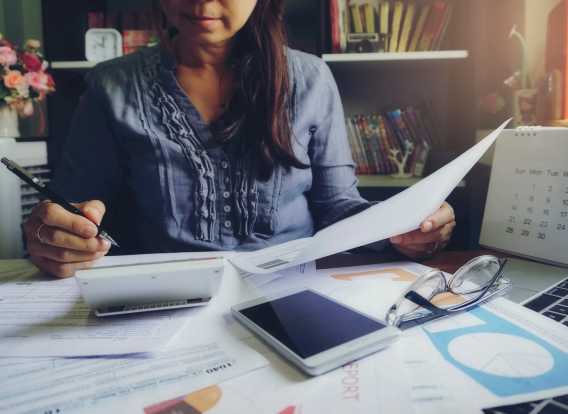 A woman filling out tax forms